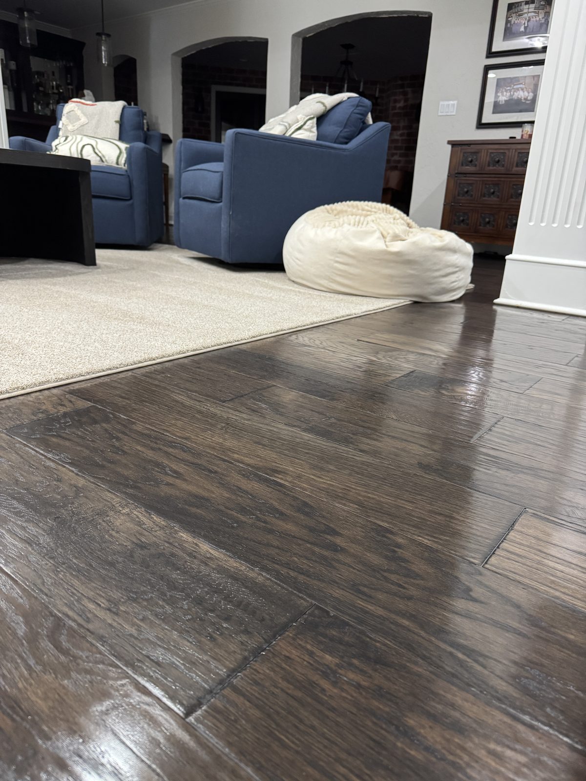 Clean living room with hardwood floors after recurring cleaning